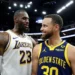 LeBron James e Stephen Curry conversam em tom sorridente após partida entre Los Angeles Lakers x Golden State Warriors